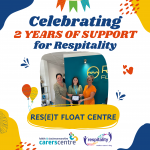 celebratory image with one of our staff handing over the respitality certificate to Reset float centre